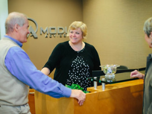 Our receptionist Denise Welcoming Clients
